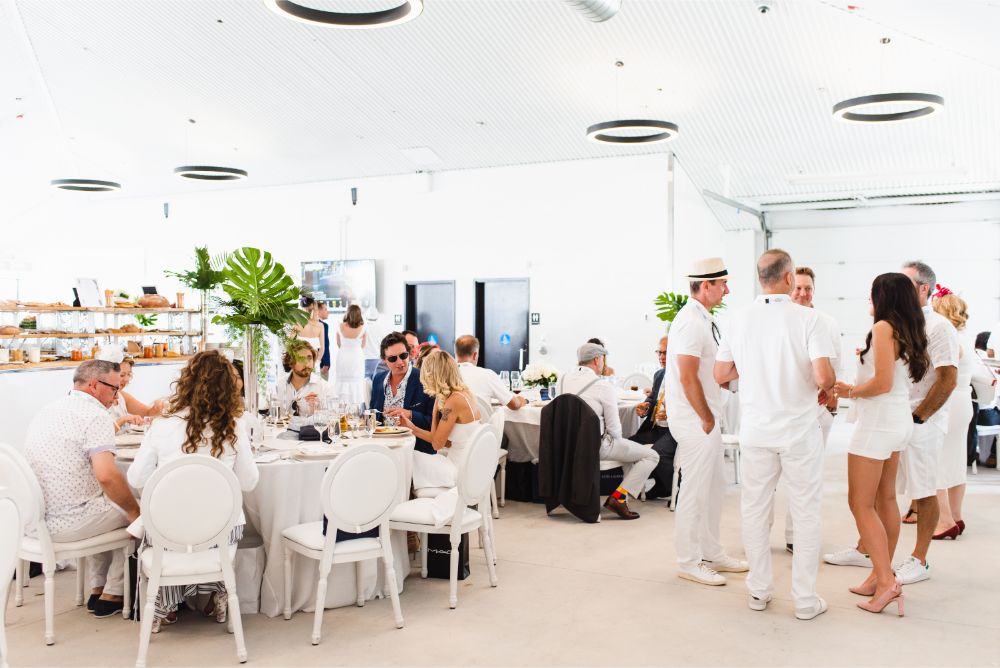 Guests dine at White Party