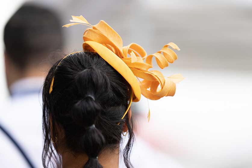 Lady with a yellow hat at Queen's Plate 2022