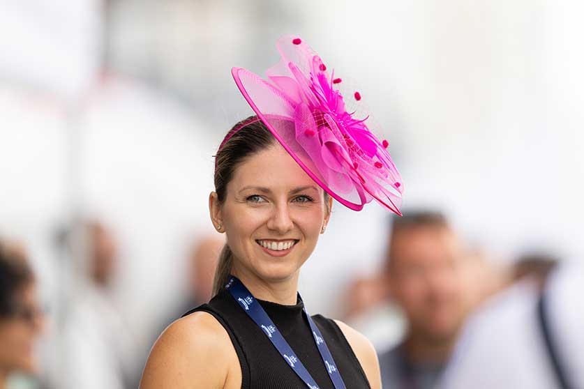 Lady wearing a pink hat at Queen's Plate 2022