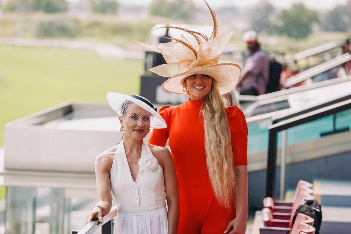 Posing for a photo during King's Plate at the Grandstand at Woodbine Racetrack.