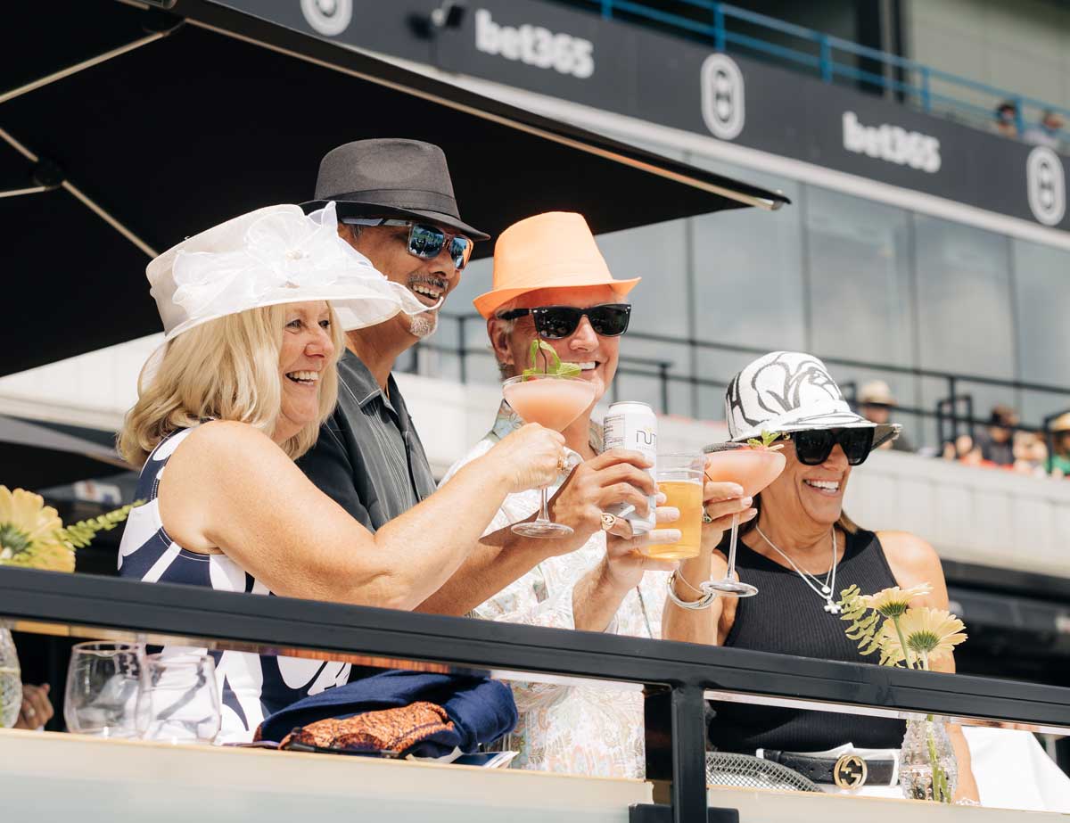 Guests enjoying drinks during Kings Plate at Homestretch Bar and Suites at Woodbine Racetrack.