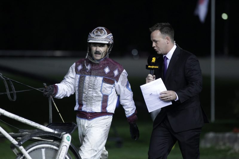 Chad Rozema interviewing Hall of Famer John Campbell following Campbell's victory with Lucky Chucky in the 2010 Canadian Trotting Classic.