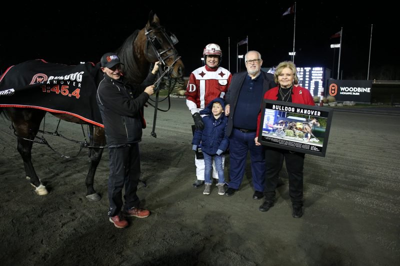 Bulldog Hanover with caretaker Johnny Mallia, trainer Jack Darling and owner Brad Grant and wife, Bonnie.