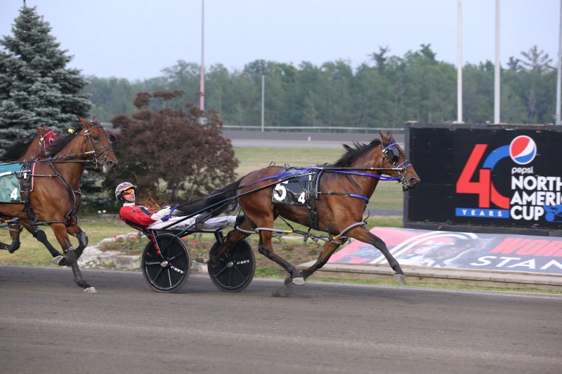 Twin B Joe Fresh and driver Dexter Dunn winning the first Fan Hanover elimination on June 10, 2023 at Woodbine Mohawk Park (New Image Media)