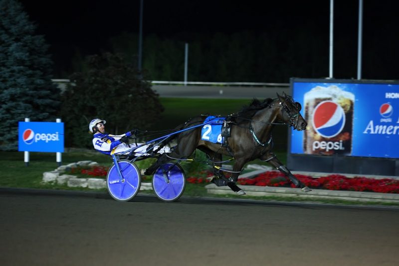 Jimmy Freight and driver Louis-Philippe Roy winning a Canadian Pacing Derby Elimination on August 27, 2022 at Woodbine Mohawk Park (New Image Media)