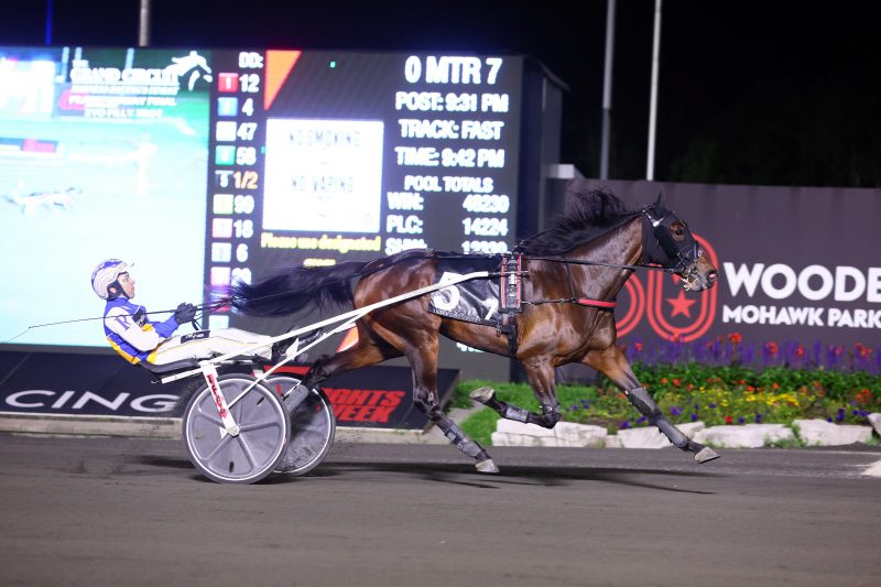 Drawn Impression and Louis-Phillippe Roy winning the Peaceful Way final on August 26, 2023 at Woodbine Mohawk Park (New Image Media)
