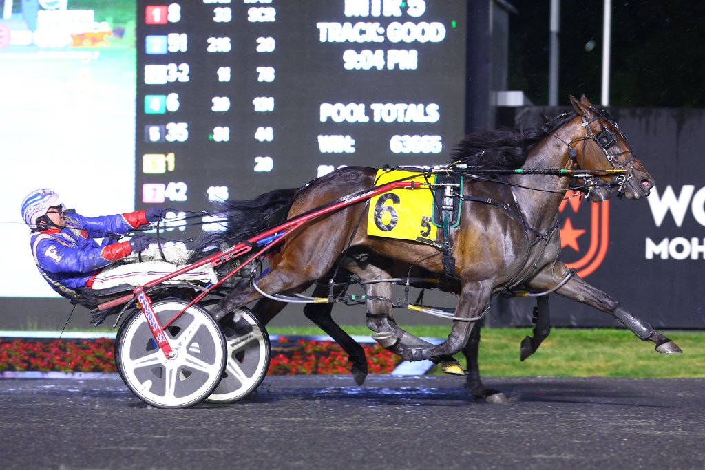 Funtime Bayama and driver Sylvain Filion winning the second Pepsi North America Cup Elimination on June 8, 2024 at Woodbine Mohawk Park (New Image Media)