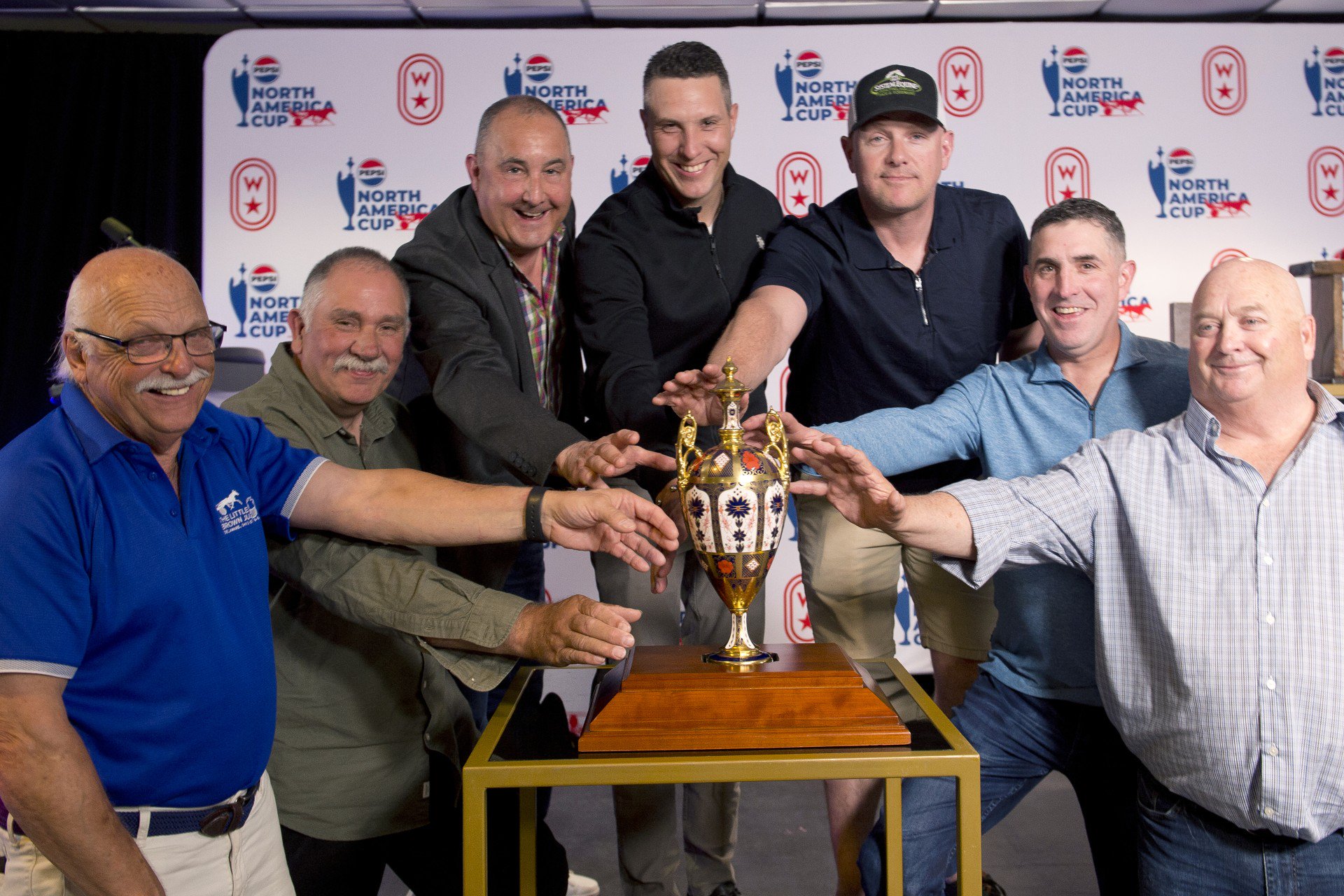 Left to right - Dr. Ian Moore, Ron MacDonald, Sylvain Filion, James MacDonald, Jody Jamieson, Anthony Beaton and Herb Holland pose with the North America Cup trophy. (Michael Burns Photo)