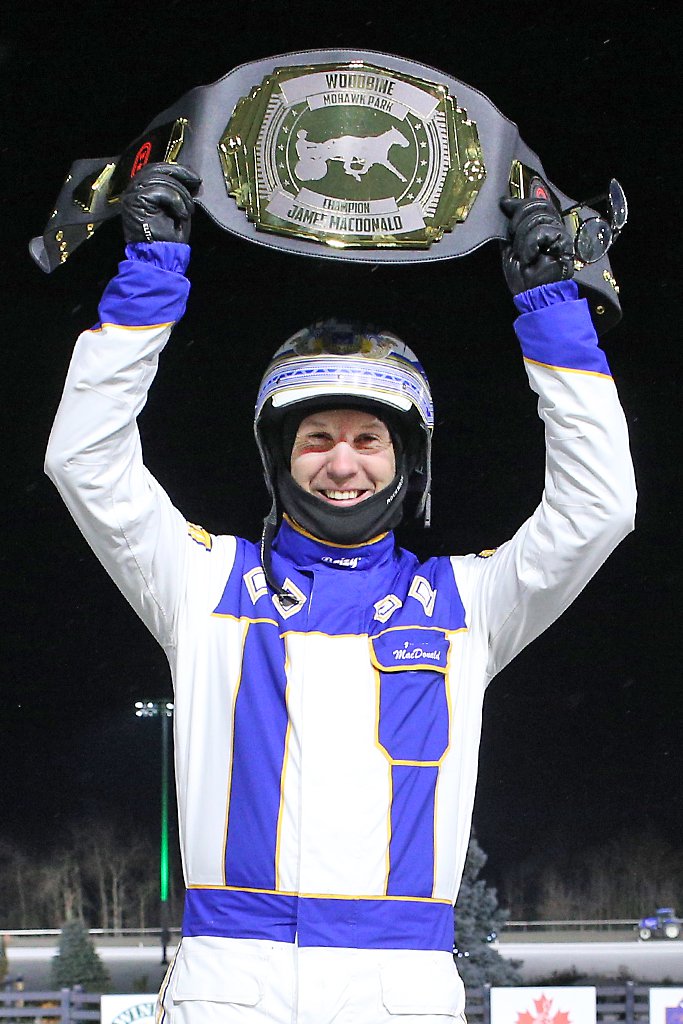 James MacDonald received a championship belt for securing his fourth consecutive Woodbine driving title. 