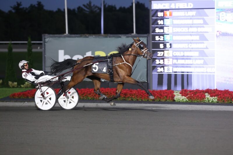 Beauts Cabaret and Doug McNair winning the Grade 3 Champlain. (New Image Media)