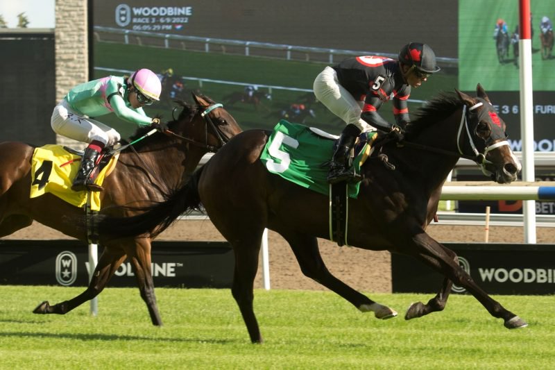 Breathing Fire and Justin Stein winning on June 9, 2022 at Woodbine. (Michael Burns Photo)