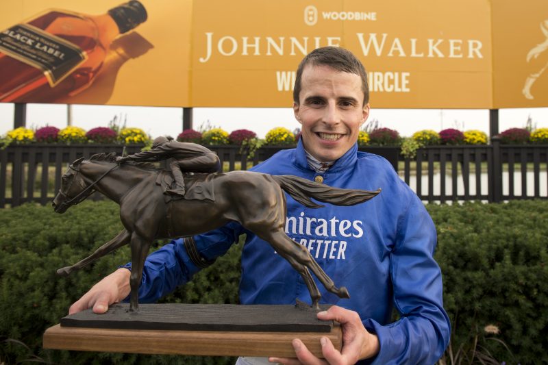 William Buick in the winner's circle after winning the 2022 Ricoh Woodbine Mile (Michael Burns Photo)