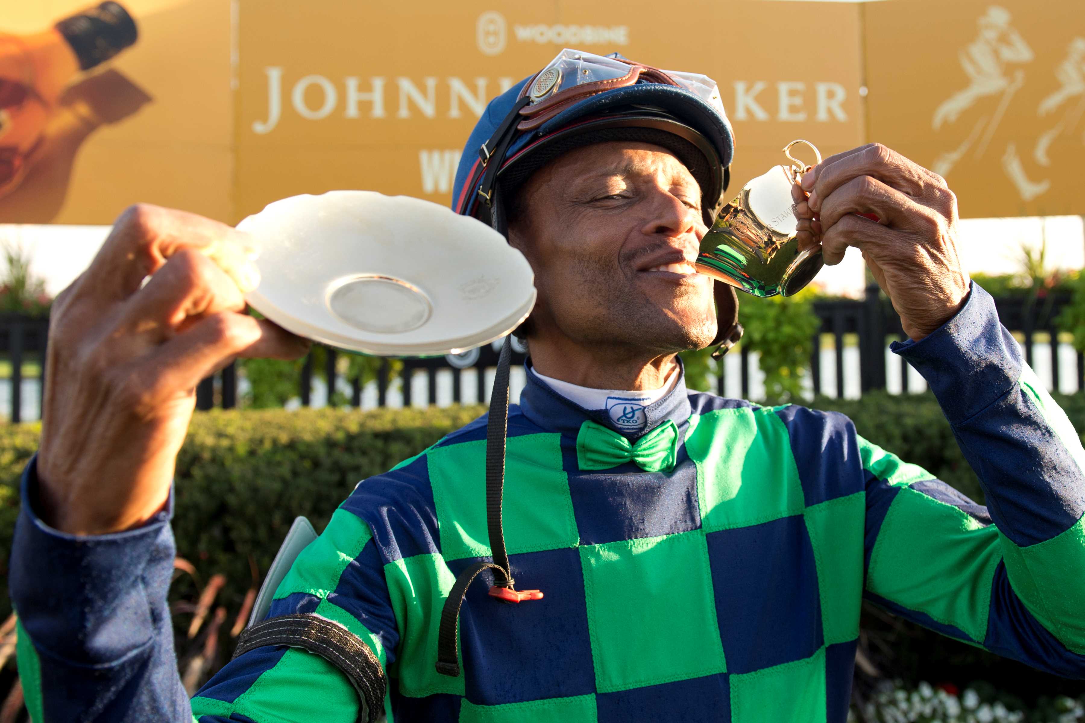 Patrick Husbands with the Cup & Saucer in Woodbine's winner circle on October 6, 2024 (Michael Burns Photo)