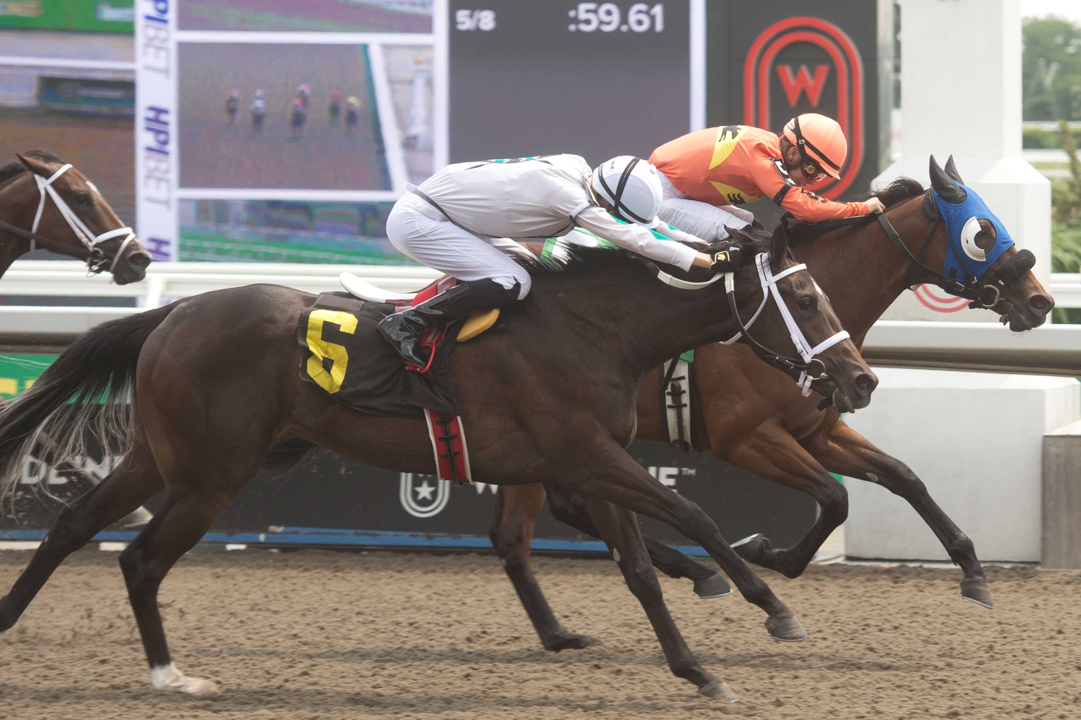 Soupergirl and jockey Fraser Aebly winning Race 3 on June 22, 2024 at Woodbine (Michael Burns Photo)