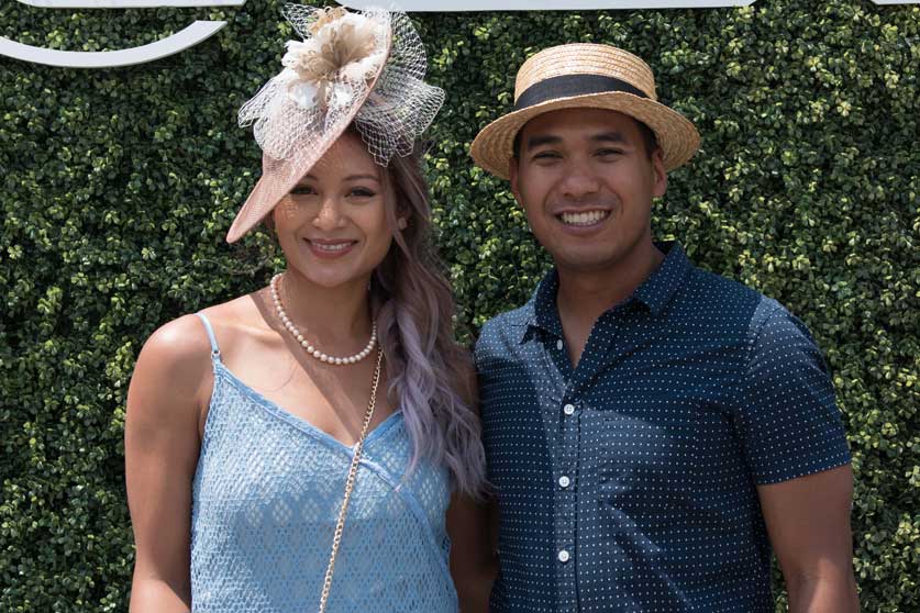 Couple posing for a photo at Queen's Plate