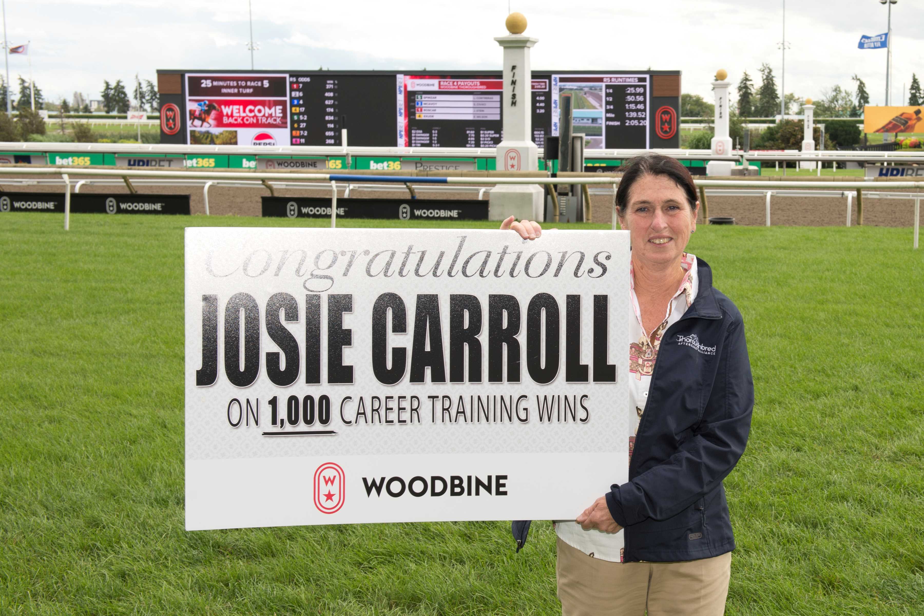 Josie Carroll celebrating 1,000 career wins at Woodbine (Michael Burns Photo)