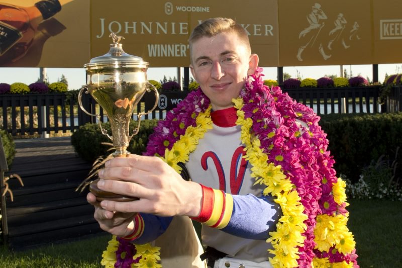 Declan Carroll holding the Breeders' Stakes trophy in Woodbine's winner's circle on October 2, 2022 (Michael Burns Photo)