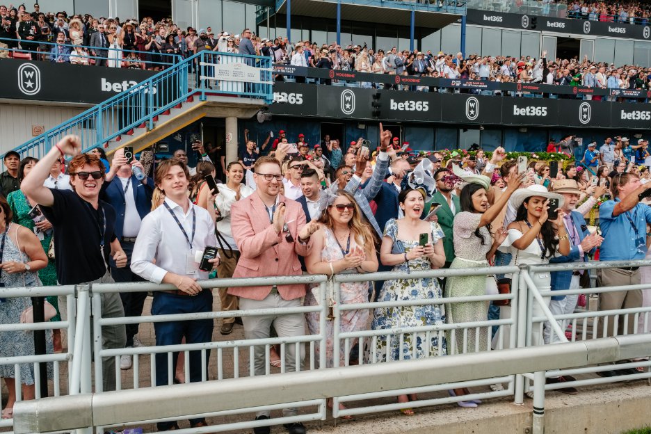 A packed grandstand and apron at the King's Plate 2023.