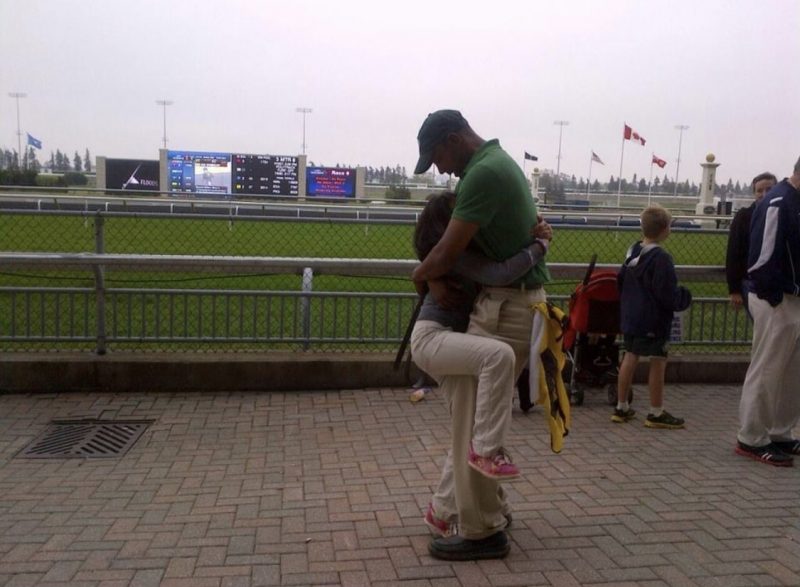 Ricky and daughter Vivian Sophia embrace at Woodbine