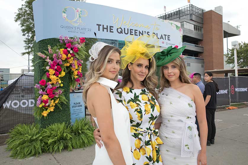 Ladies posing for a photograph at Queen's Plate 2022