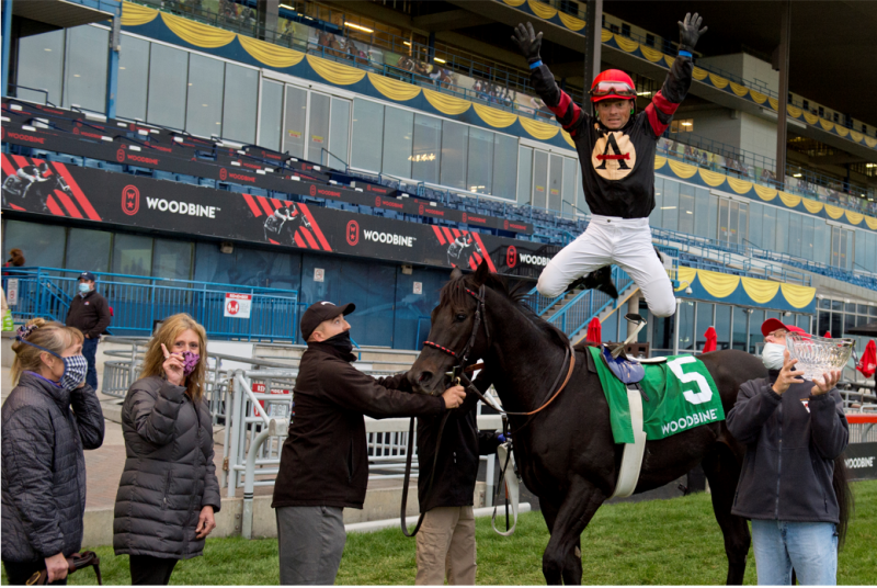 Silent Poet and Justin Stein celebrate with Nick Gonzalez winning the Nearctic Stakes at Woodbine in 2020. (Michael Burns Photo)