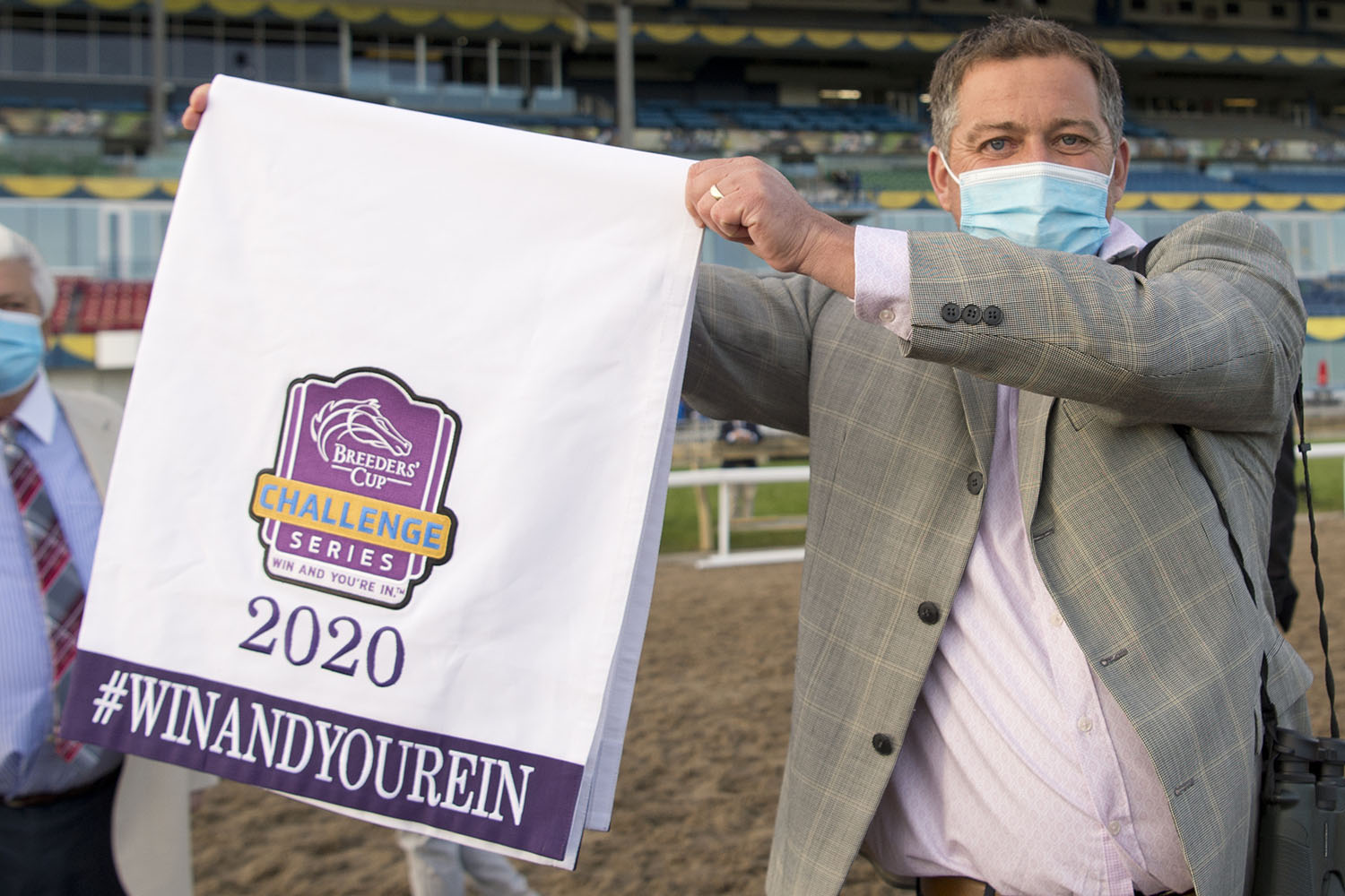 Trainer Kevin Attard shows off Starship Jubilee's Breeders' Cup 'Win And You're In' saddle cloth. (Michael Burns Photo)