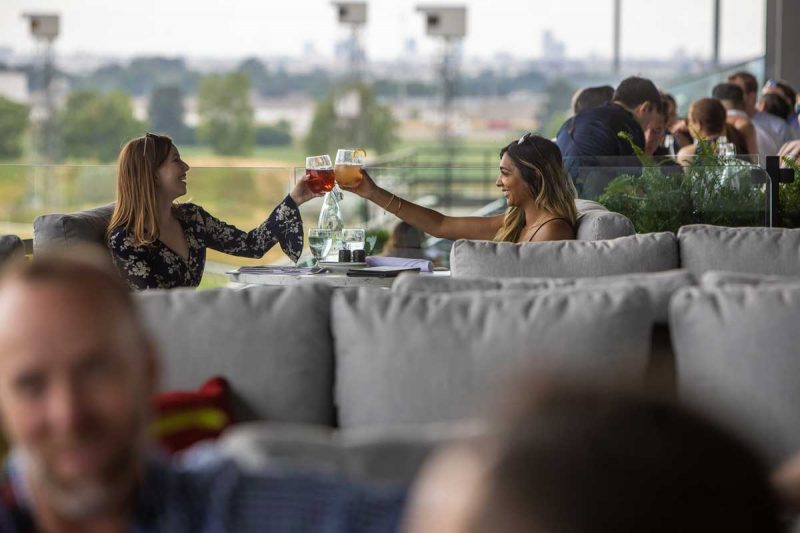 Guests cheering at Stella Artois Terrace at Woodbine Racetrack enjoying the unique patio experience.