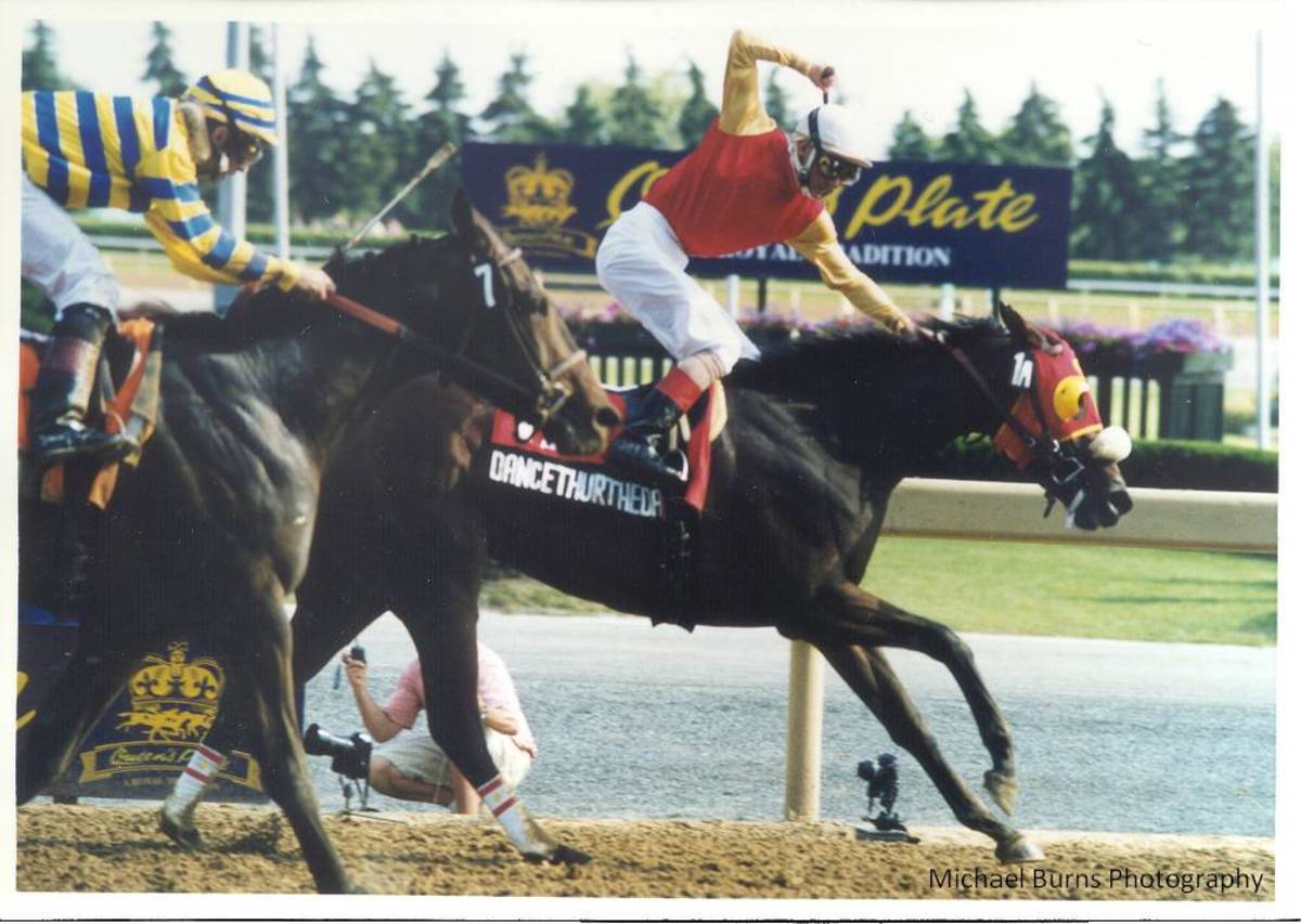 Dancethruthedawn and Gary Boulanger winning the 2001 Queen's Plate (Michael Burns Photo)
