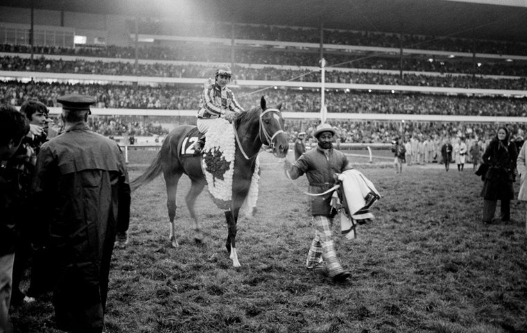 Secretariat and jockey Eddie Maple make their way to the winner's circle after winning the 1973 Canadian International at Woodbine (Photo by Michael Burns)