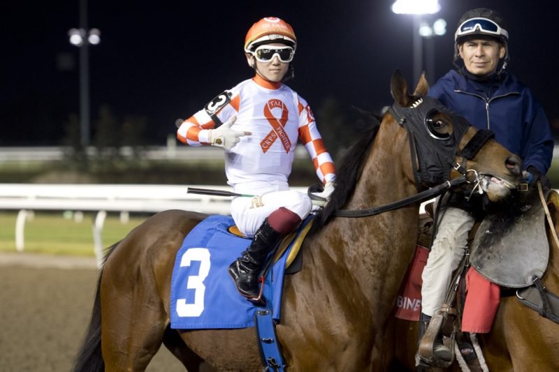 Kazushi Kimura, aboard Graceful Fighter, wearing TEC Racing's orange silks to spread awareness for complex regional pain syndrome (CRPS). (Michael Burns Photo)